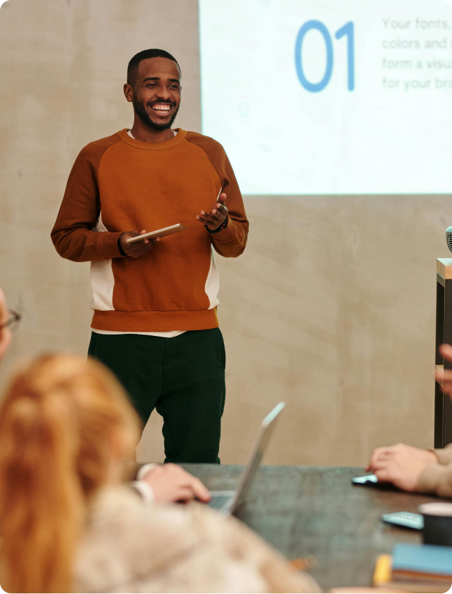 Man giving a presentation in a classroom setting
