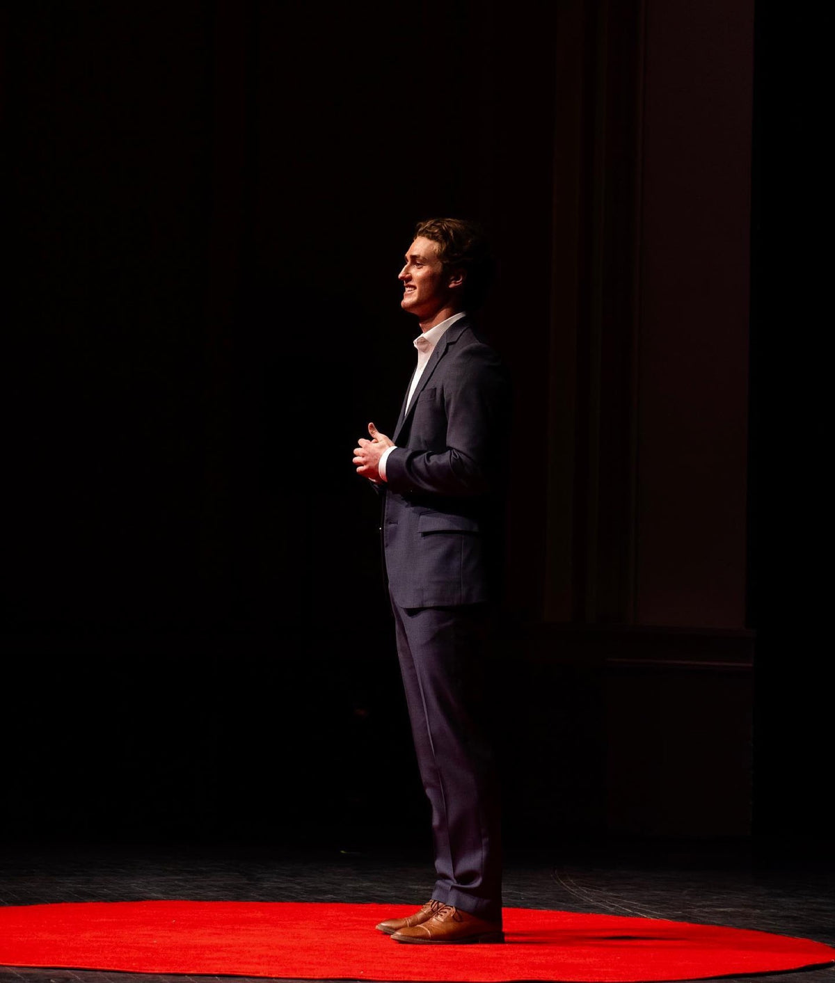 Chris Magee speaking on a TEDx stage